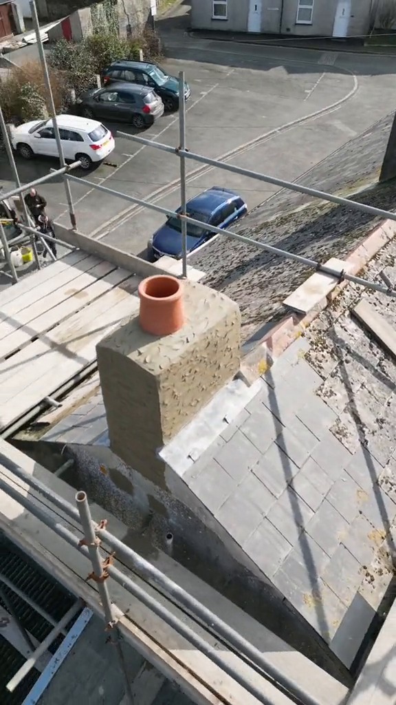 Completed chimney rebuild with render and leadwork