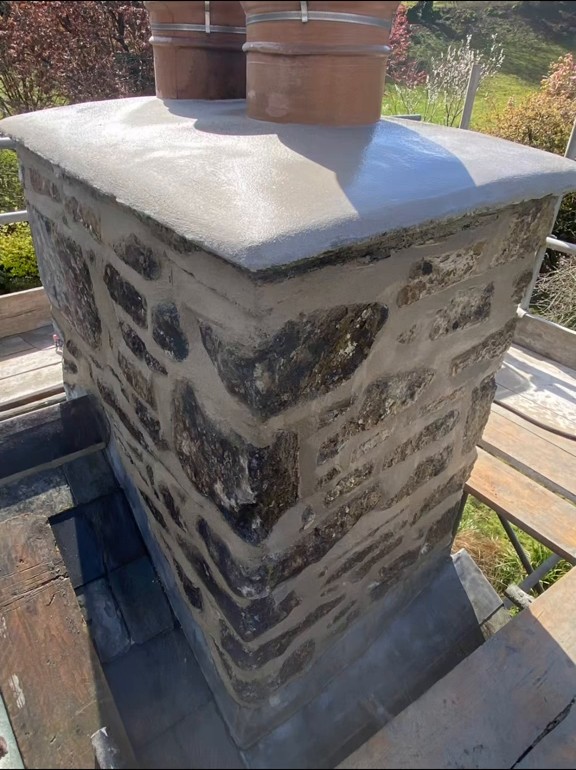 Repointed stone chimney and renewed flaunching